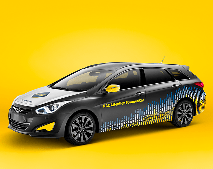 Rendering of a car with RAC Attention powered car written on side