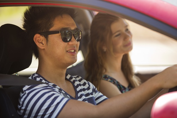 YOUNG DRIVERS IN A CAR