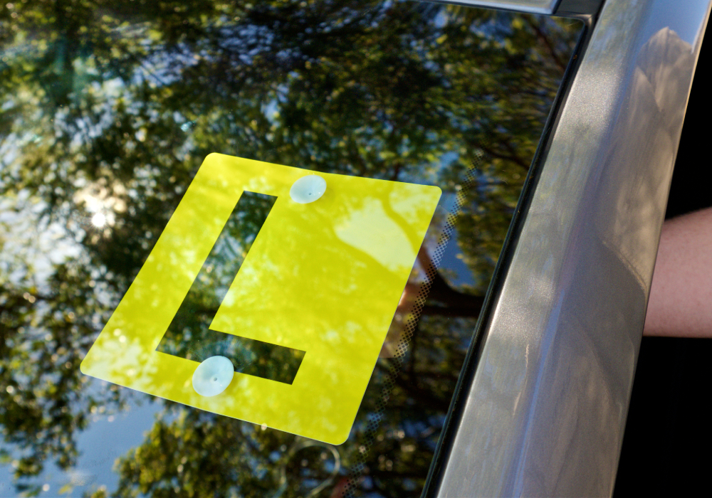 L Plate on front window of car