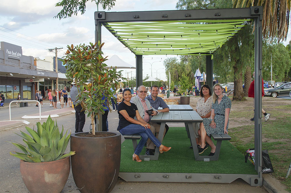 A group of people enjoying an outdoor dining area in Merredin