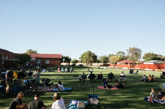 Community having picnics on new park area
