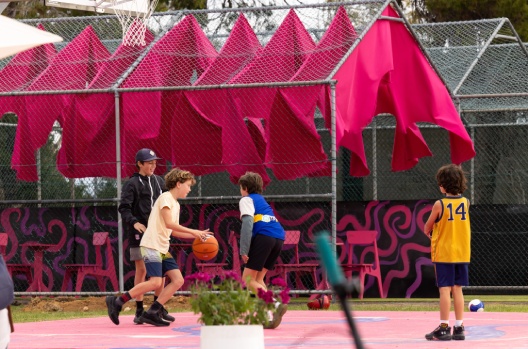 Children playing basketball at park