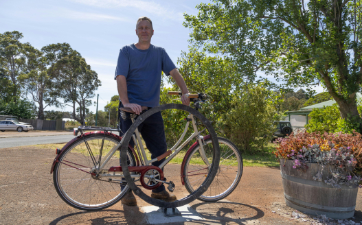 Man standing with his bike