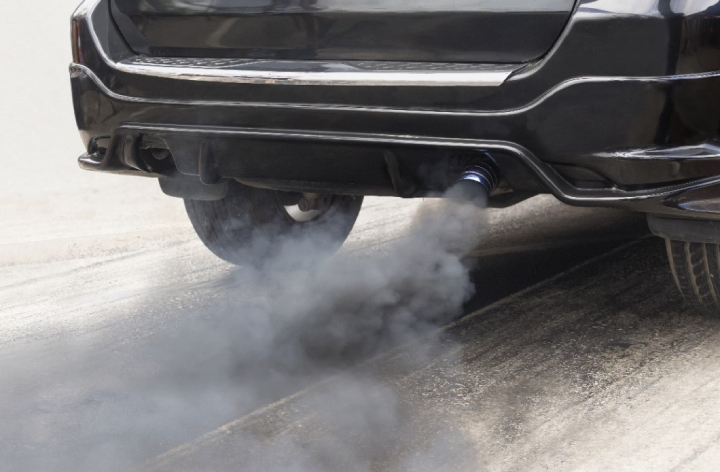 Grey smut coming out of back pipe of car