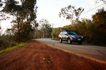 Land cruiser driving on regional road