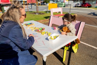 Child and mother at craft table