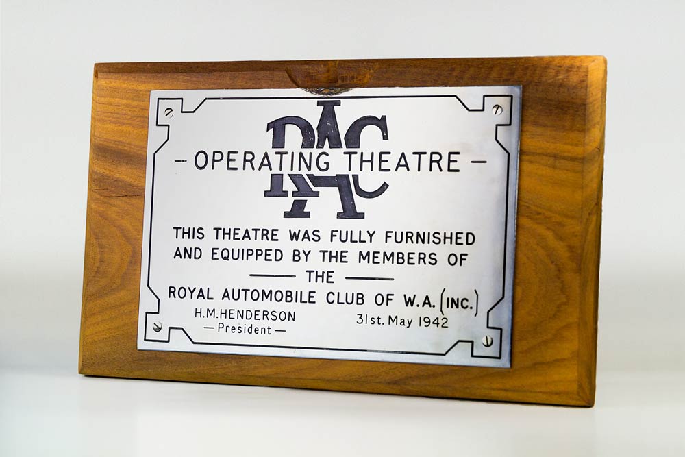 A silver plaque, dated 31st May 1942, commemorating the RAC's involvement in furnishing and equipping the state-of-the-art operating theatre.