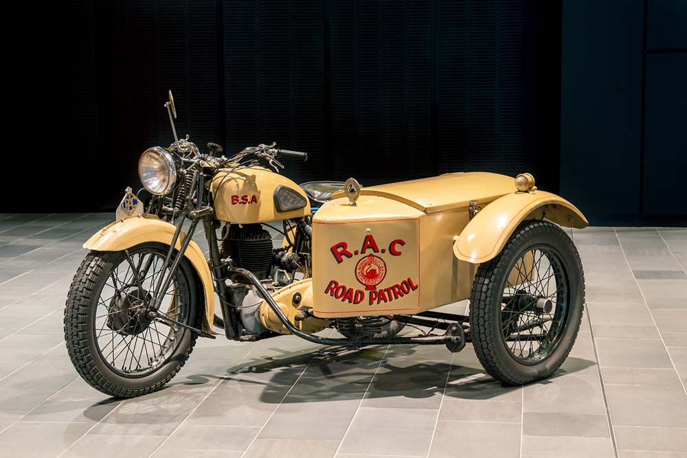 The yellow BSA motorcycle with sidecar, where the words "RAC Road Patrol" are clearly marked in red.