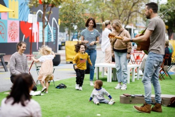 People enjoying live music in street plaza