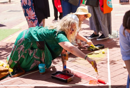 People painting floor mural