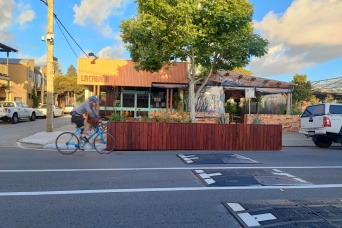 Cyclist riding past bike hub