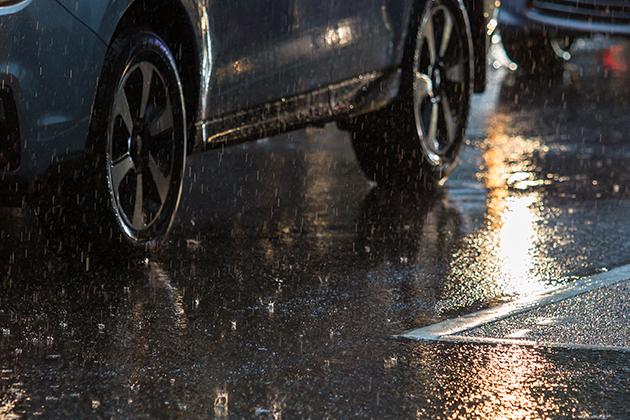 Image of cars driving on wet road