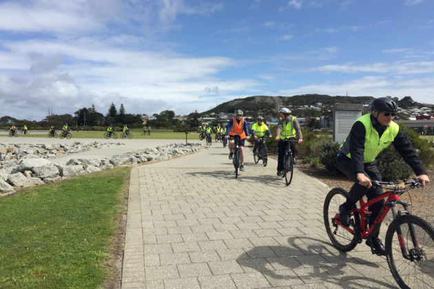A group of cyclists riding ebikes