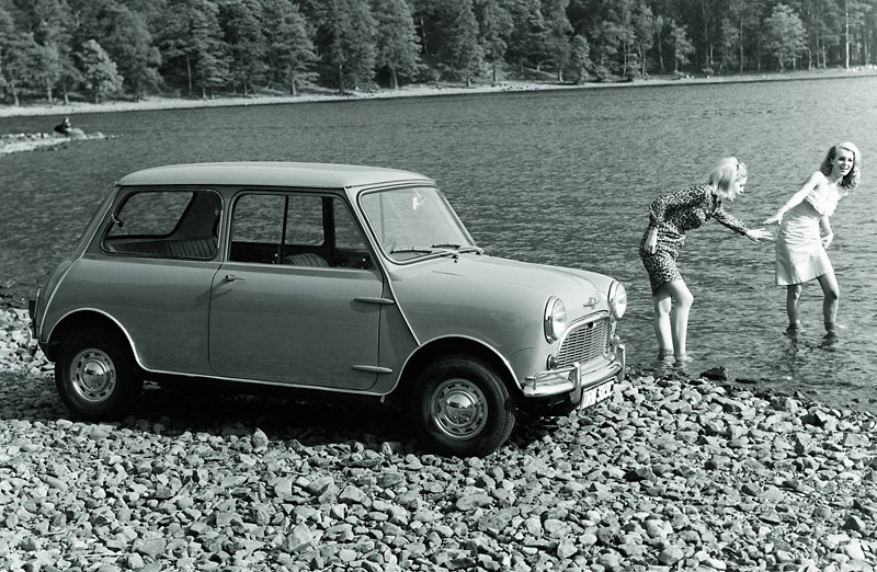 Mini - Forget big car, big country, the Mini was all about celebrating small. The mini car was a hit in the era of the mini skirt, which these two probably should have worn before they waded into a rocky lake.