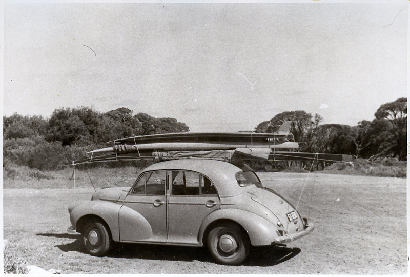 John Budge’s Morris Minor with plywood boards tied down to the roof of the car. Yallingup car park,1956. Image: Supplied by Jim King courtesy of John Budge.