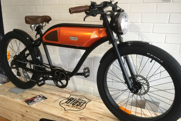 The striking orange model of the Greaser ebike in Bikemore