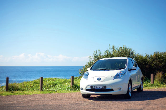 White Nissan Leaf parked near the beach