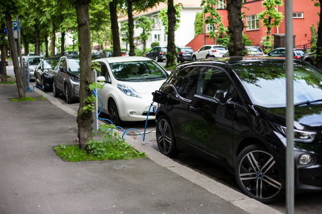 Electric vehicles charging on the road in Oslo, Norway