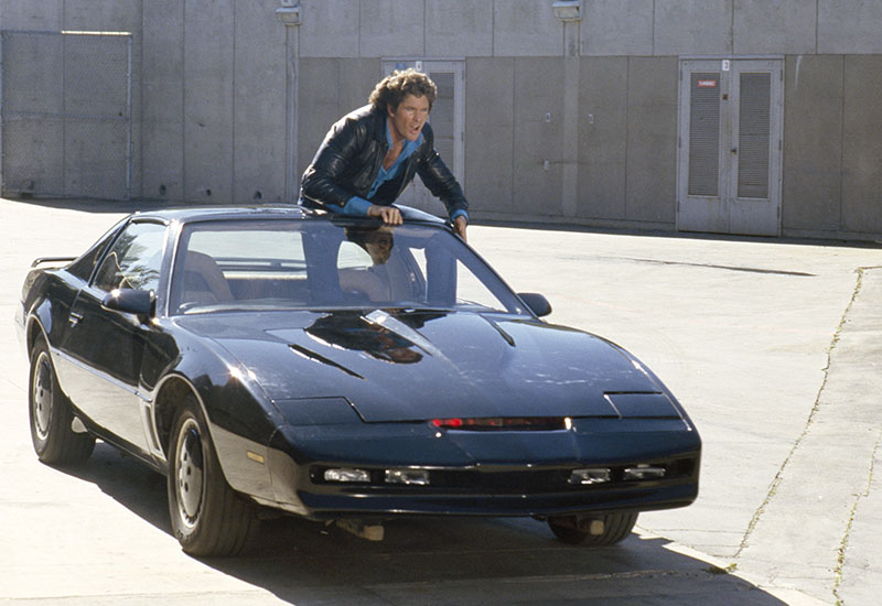 Knight Rider: The high-powered and intelligent Pontiac Trans-Am in the crime-fighting franchise Knight Rider was way ahead of its time. Michael Knight (David Hasselhoff) was grateful to leave the driving to KITT while he was busy fighting the bad guys. Aside from grappling hooks and a flamethrower, the car also had auto collision-avoidance technology and a homing device – both technologies being further developed today. 