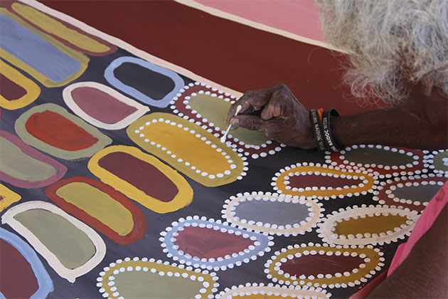 Minnie Lumai painting at Waringarri Aboriginal Arts