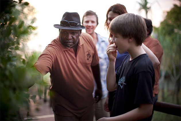 A tour guide teaching tourists about bushtucker in the  Kimberley