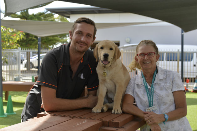 Josh Crawford, puppy Shane and raiser Leanne Rogers