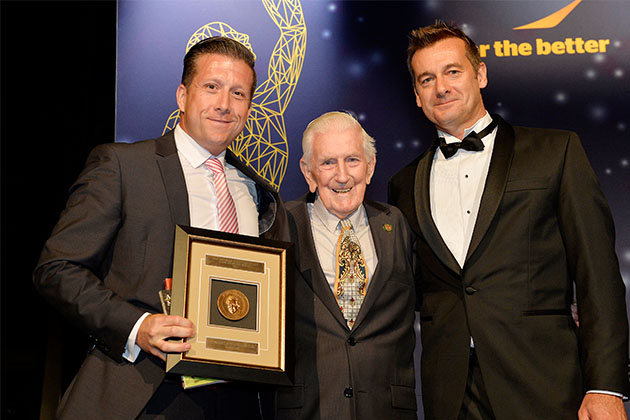Matt Whelan with his award, John Gilmour and Andrew O'Hara