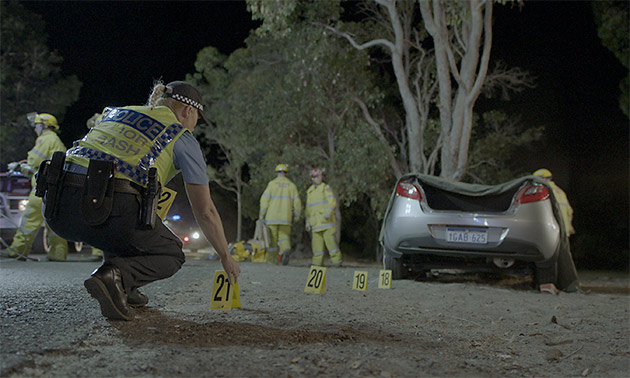 WA Police crash investigation officers mark the scene of a road crash