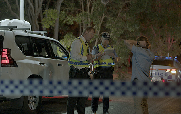 WA Police crash investigation officers conduct interviews at the scene of a road crash