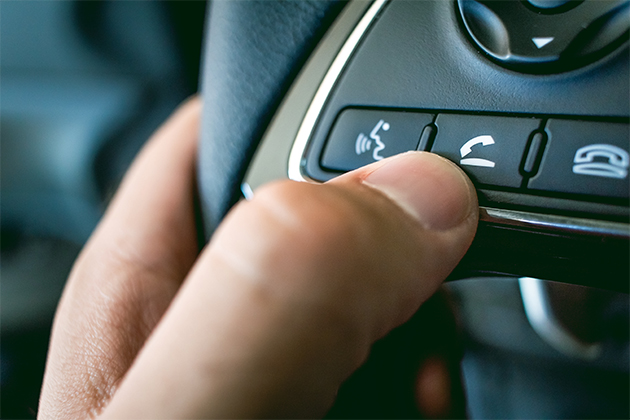 Image of voice assist on steering wheel