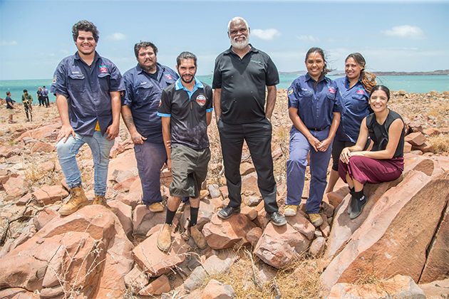 Image of Peter Jeffries (centre) with the Murujuga Aboriginal Corporation