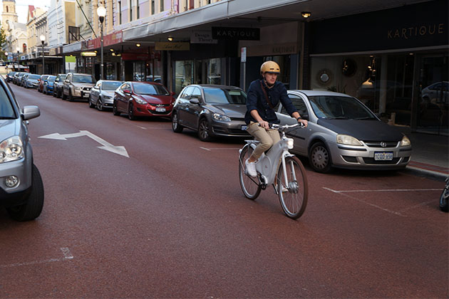 A Tiller ebike user riding down the street