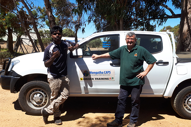 Wongutha CAPS student Gary Wallaby with driver training coordinator Andrew Waters
