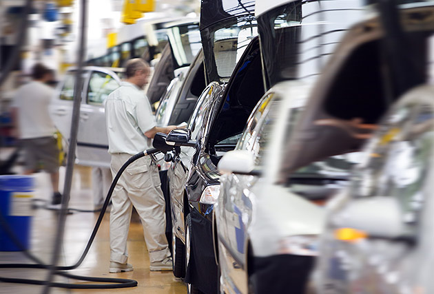 Car assembly line factory worker