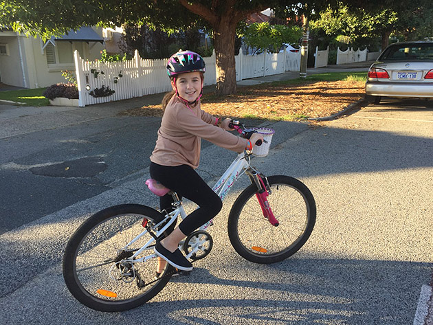 Nine-year-old Annabel on her bicycle