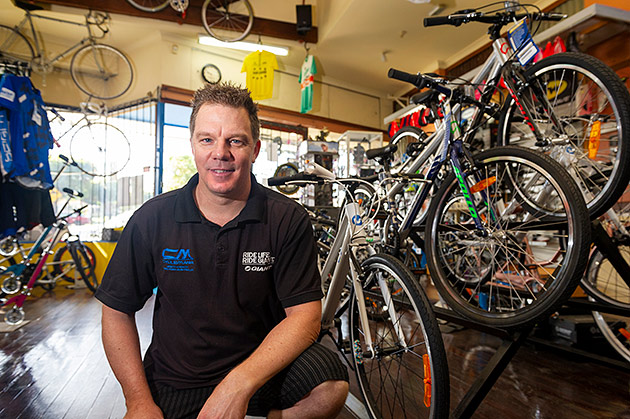 Wayne Evans in his bike shop Cyclemania