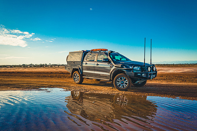 Car sitting on pile of water