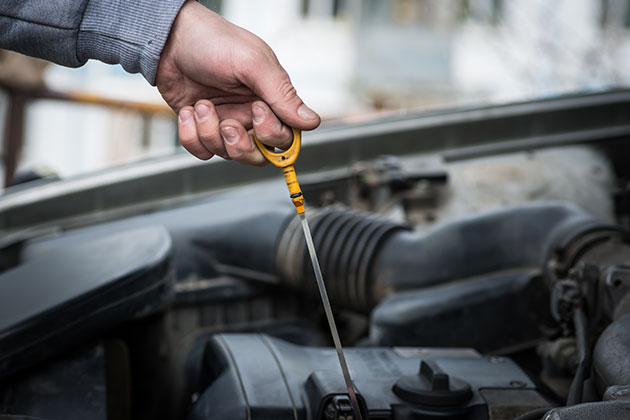 Removing oil stick from car engine