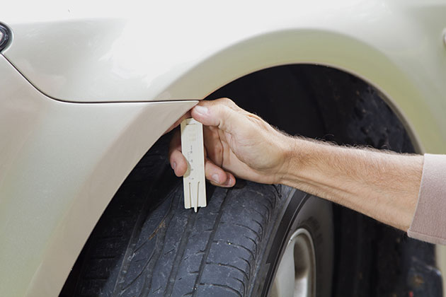 Checking car tyre tread