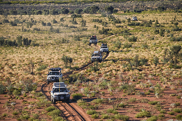 Multiple four-wheel drives on a dirt track