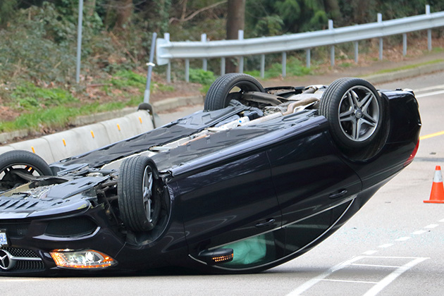 Car rolled over on road