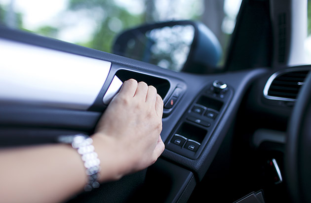 Hand on a car door handle