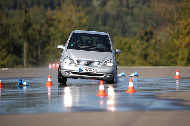 Car skidding on road with traffic cones