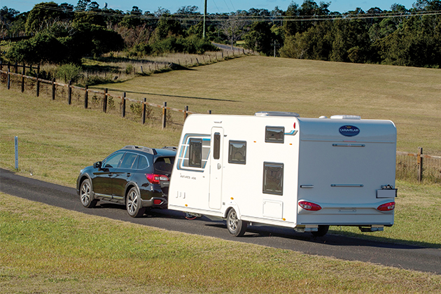 Image of a car towing a caravan