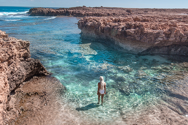 Image of woman walking through water