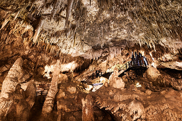 Person standing inside a cave