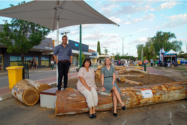 Image of people sitting on a log