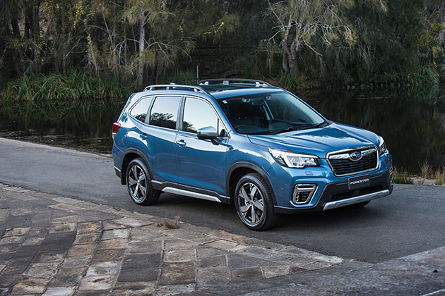 Blue Subaru on the road