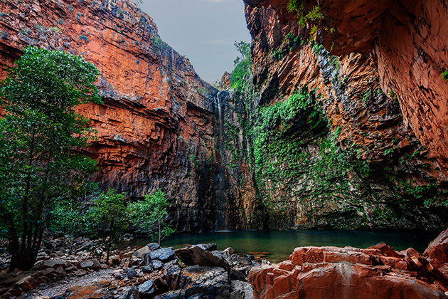 Waterfall against red rock