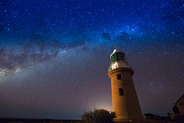 Image of a lighthouse at night